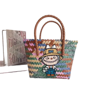 Colorful woven tote bag with cartoon patch.