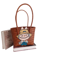 Brown woven tote bag with cartoon patch.