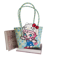 Woven blue and yellow tote bag with cartoon character.