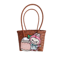 Brown woven tote bag with cartoon patch.