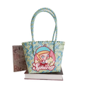 Woven blue and green tote bag with cartoon girl.