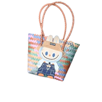 Colorful woven tote bag with bunny patch.