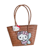 Woven tote bag with Hello Kitty embellishments.
