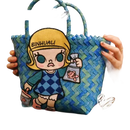 Blue woven tote bag with cartoon patch.