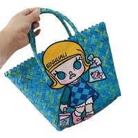 Blue woven tote bag with cartoon girl.