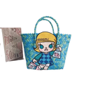 Blue woven tote bag with cartoon girl.