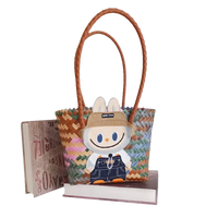 Woven tote bag with cartoon patch.