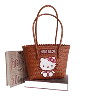 Brown woven handbag with Hello Kitty design.