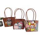 Three woven tote bags with cartoon character embellishments.