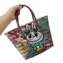 Woven tote bag with cartoon bunny patch.