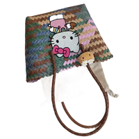 Woven tote bag with Hello Kitty embellishments.