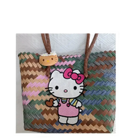 Woven tote bag with Hello Kitty embellishments.