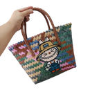 Woven tote bag with cartoon patch.
