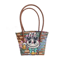 Woven tote bag with cartoon bunny.