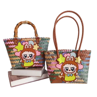 Two woven tote bags with cartoon character embellishments.