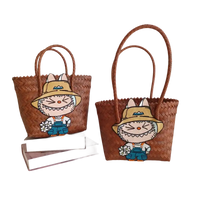 Two brown woven tote bags with cartoon rabbit patches.