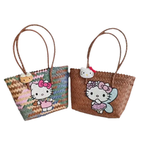 Two Hello Kitty woven tote bags.