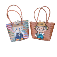 Two woven tote bags with cartoon character appliqués.