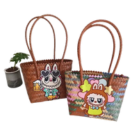 Two woven tote bags with cartoon embellishments.