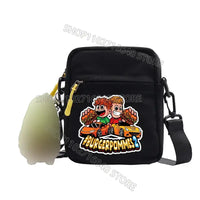 Black shoulder bag with cartoon sticker.