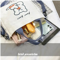 Canvas tote bag with bear design.