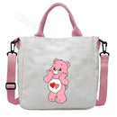White tote bag with pink accents and a Care Bear design.