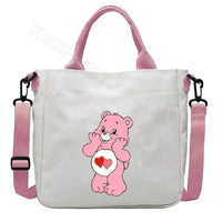 White tote bag with pink accents and a Care Bear design.