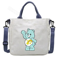 White tote bag with blue accents and a cartoon bear.
