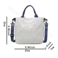 White tote bag with blue handles and strap.