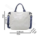 White tote bag with blue handles and strap.
