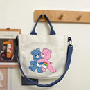 White tote bag with cartoon bears.