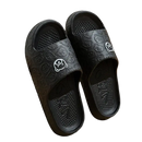 Black cartoon-patterned slide sandals.