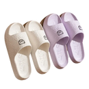White and purple cartoon-themed slippers.