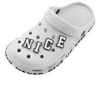 White clog with letter and number charms.