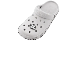 White clog with letter and number charms.
