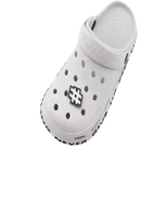 White clog with letter charms.
