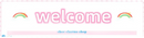 Welcome’ sign with rainbows.