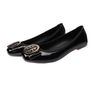 Black patent leather ballet flats with gold buckle.