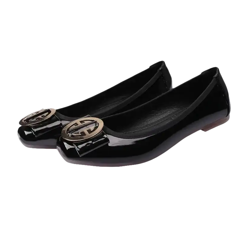 Black patent leather ballet flats with gold buckle.