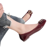 Burgundy patent leather ballet flats.
