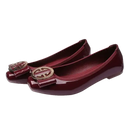 Burgundy patent leather ballet flats.