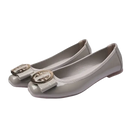Gray patent leather ballet flats with gold buckle.