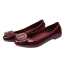 Burgundy patent leather ballet flats with gold buckle.