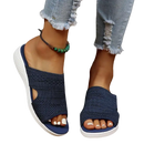 Blue knit slide sandals.