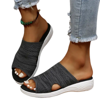 Gray knit slide sandals.