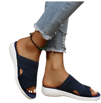 Navy knit slide sandals.
