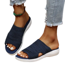 Navy knit slide sandals.