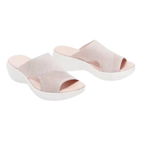 Pair of pink knit slide sandals.