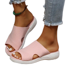 Pink knit slide sandals.