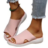 Pink knit slide sandals.